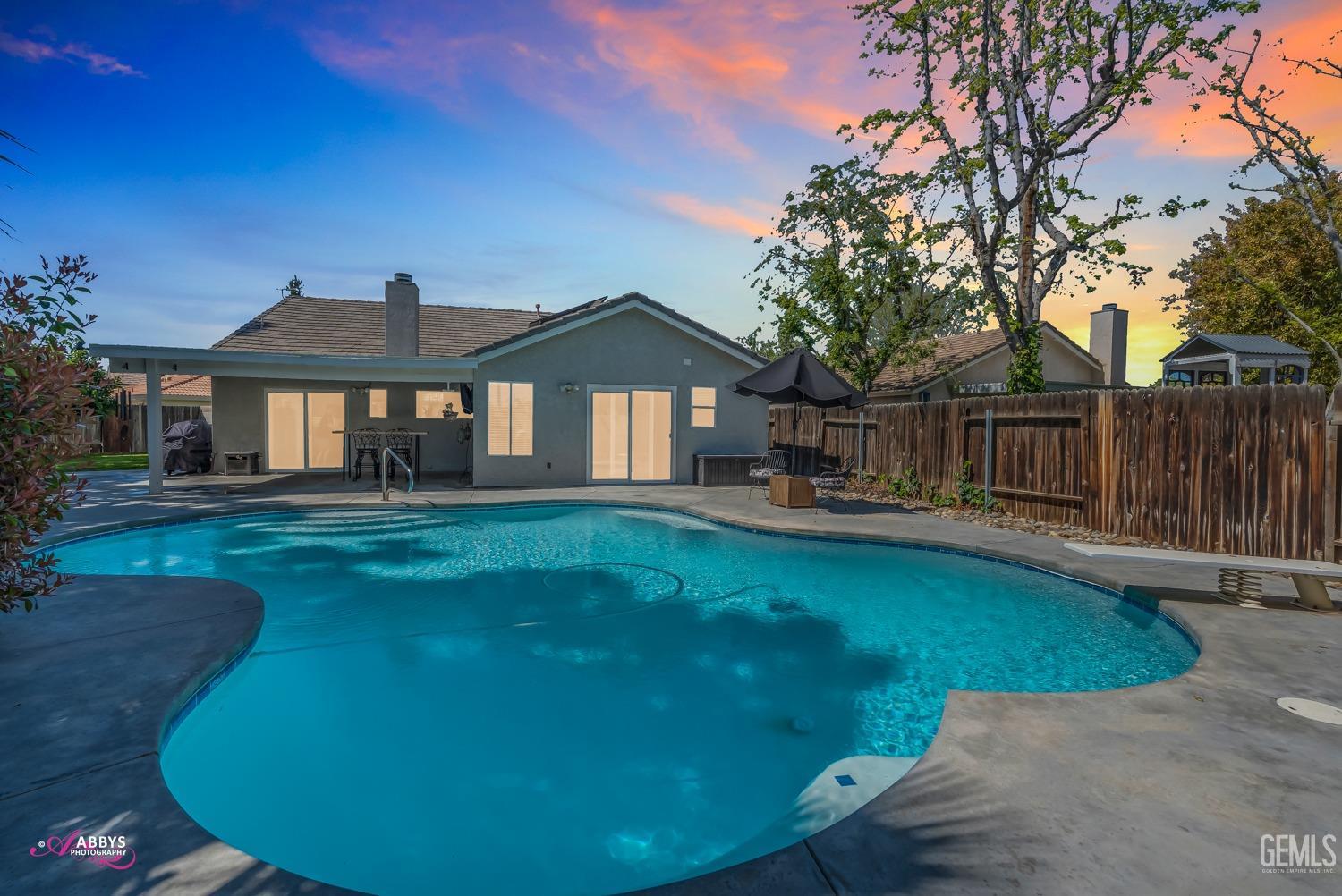 Undisclosed Address Bakersfield, CA 93312 - Photo 18 of 30 a front view of a house with garden