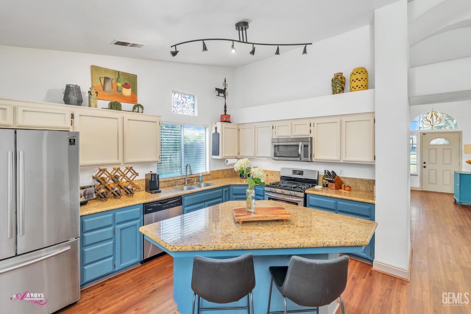 Undisclosed Address Bakersfield, CA 93312 - Photo 5 of 30 a kitchen with stainless steel appliances granite countertop a sink a refrigerator and a stove