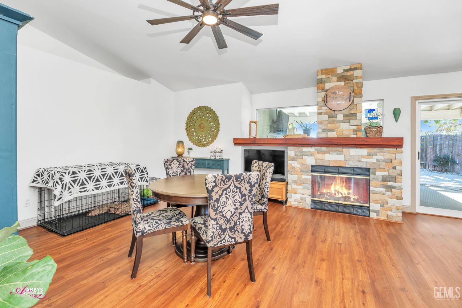 Undisclosed Address Bakersfield, CA 93312 - Photo 7 of 30 a living room with furniture and a fireplace