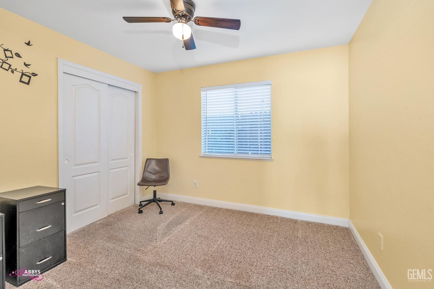 Undisclosed Address Bakersfield, CA 93312 - Photo 8 of 30 a living room with furniture and a window