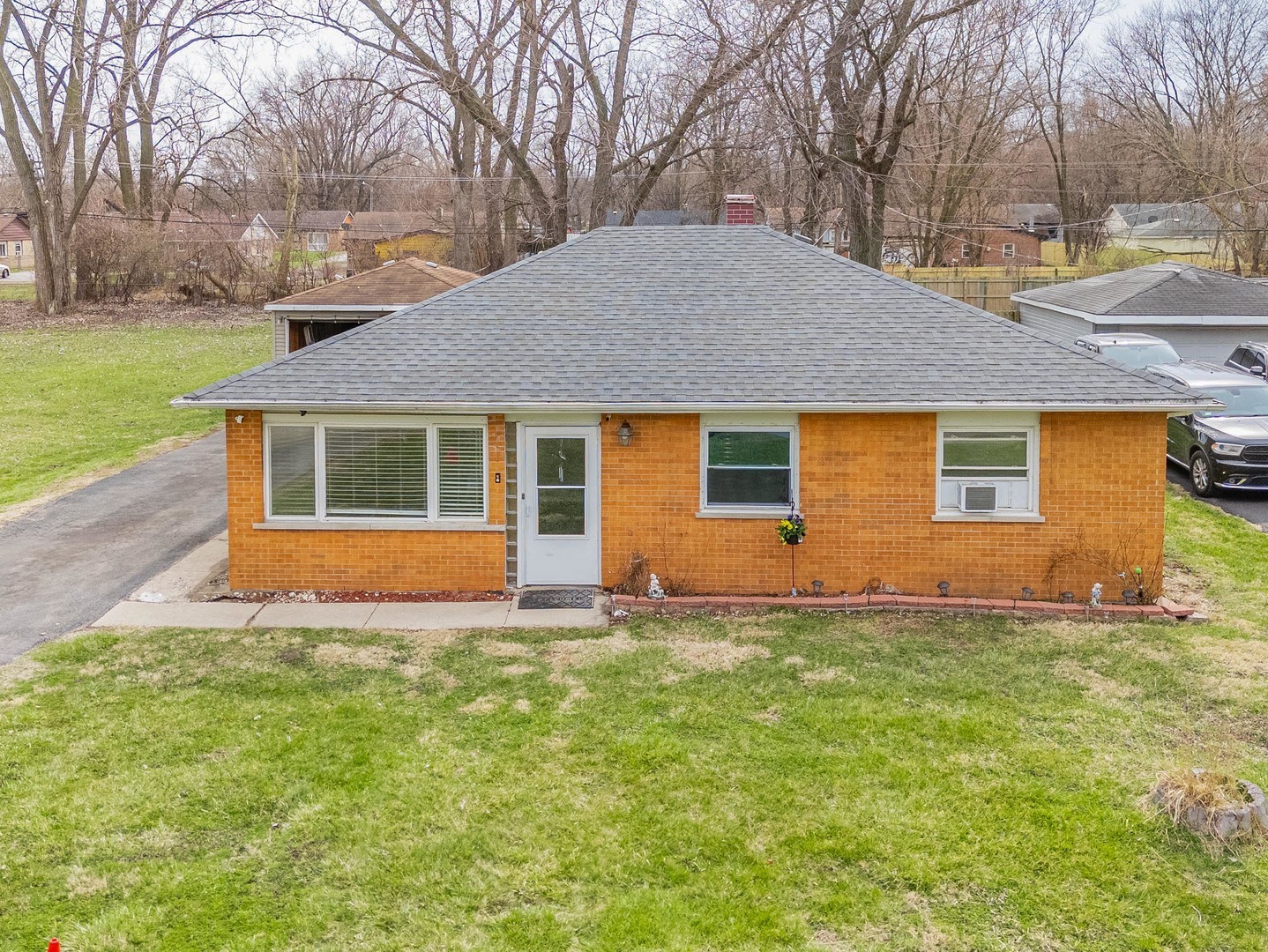 15316 Parkside Drive Markham, IL 60428 - Photo 1 of 14 a front view of a house with a yard