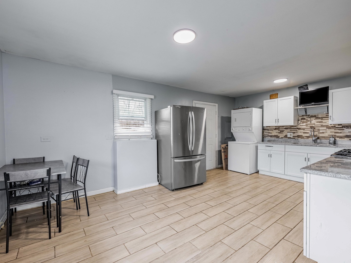 15316 Parkside Drive Markham, IL 60428 - Photo 6 of 14 a kitchen with a refrigerator and table chairs
