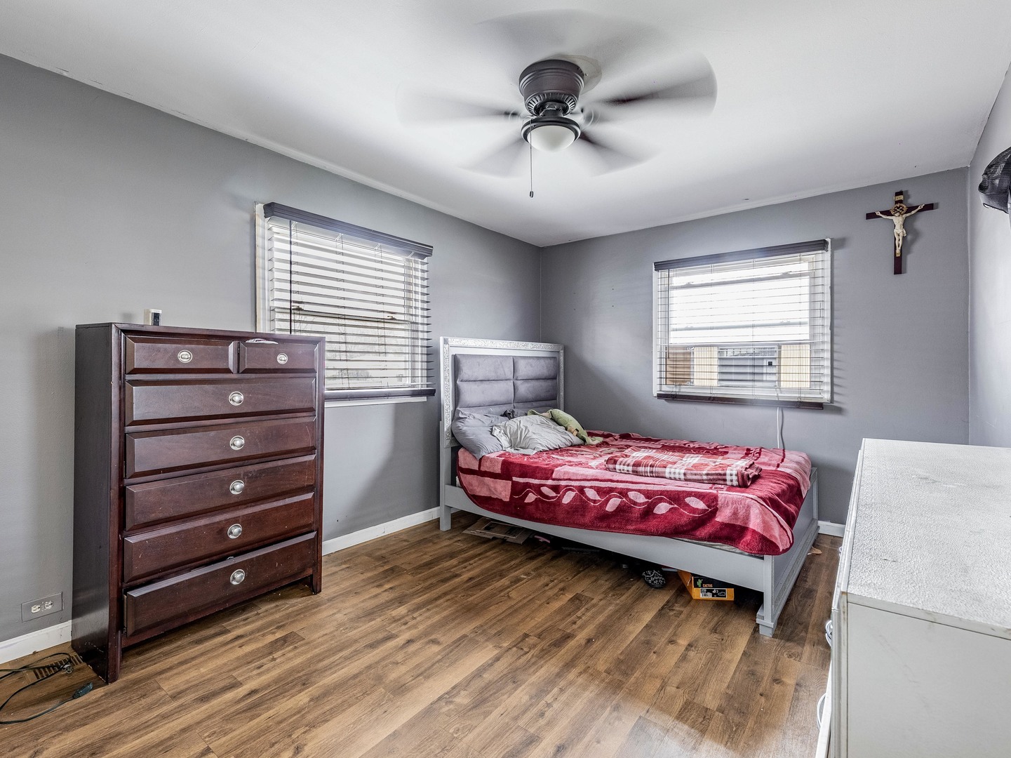 15316 Parkside Drive Markham, IL 60428 - Photo 9 of 14 a bedroom with a bed and a chandelier
