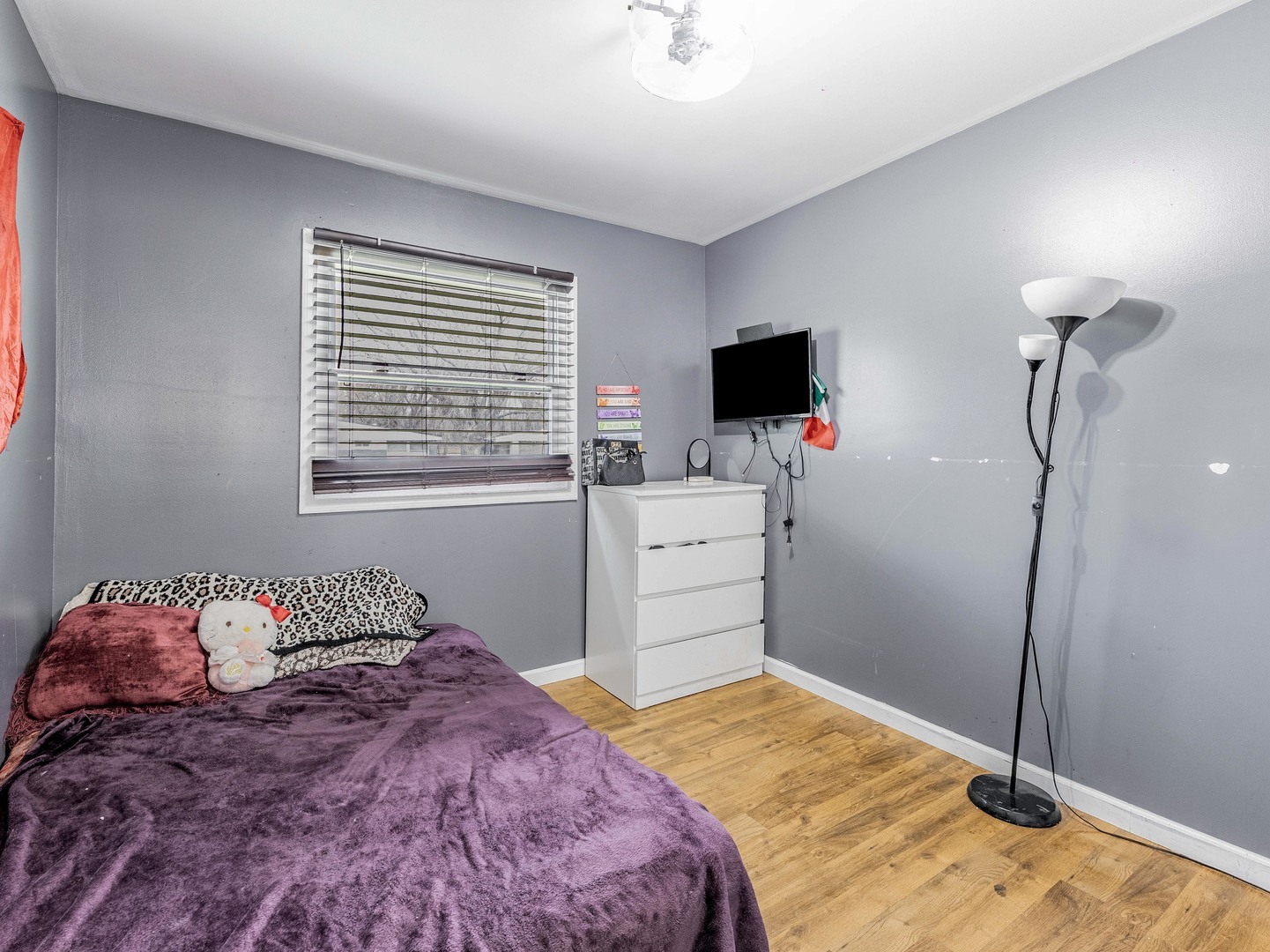 15316 Parkside Drive Markham, IL 60428 - Photo 10 of 14 a bedroom with a bed and a flat screen tv