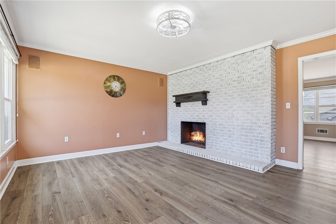 4304 Old Buncombe Road Greenville, SC 29617 - Photo 5 of 49 This inviting living space features an elegant fireplace, perfect for cozy gatherings and stylish comfort.