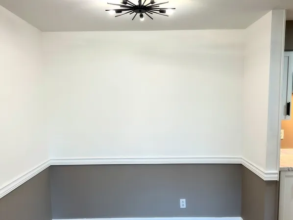 a close view of cabinet with a floor to ceiling window