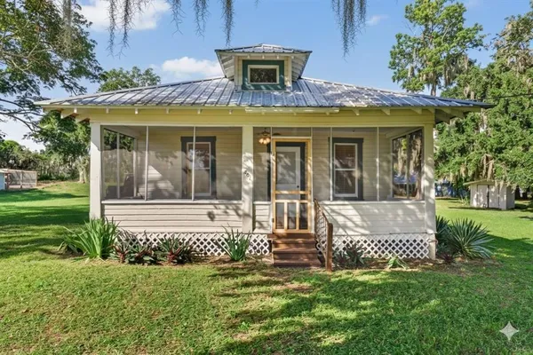 a view of a house with a bed and garden