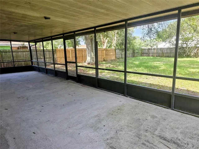 a view of an empty room with a large window