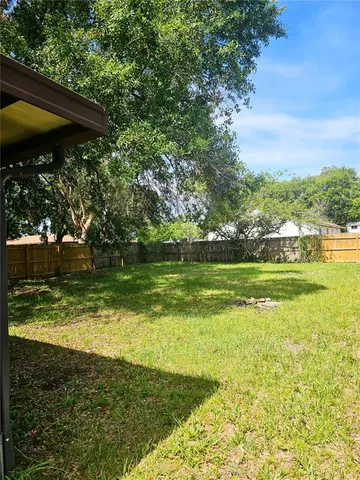 a view of a golf course with a lake view