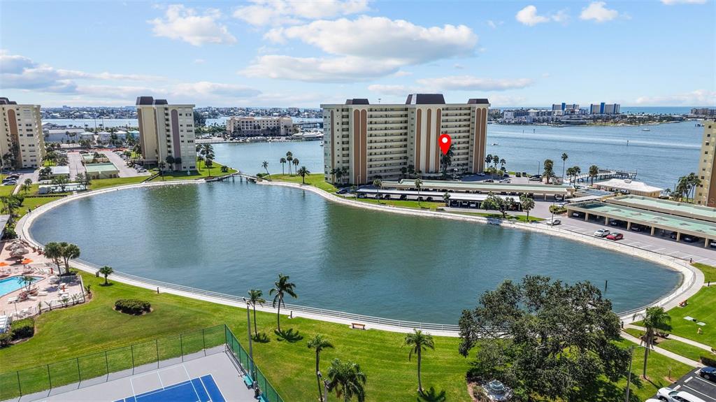 4775 Cove Circle, Unit 407 St. Petersburg, FL 33708 - Photo 1 of 1 a view of a swimming pool with a terrace