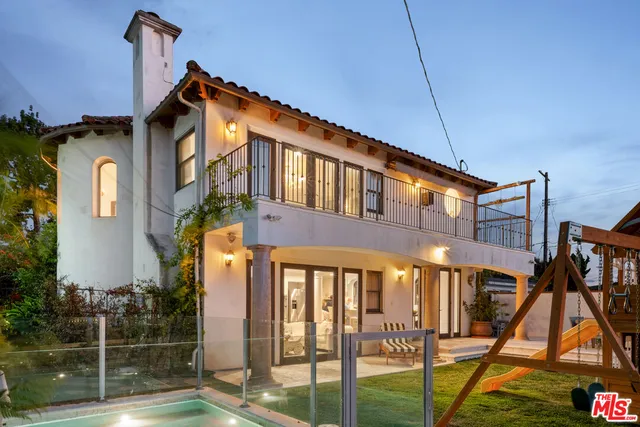 a front view of a house with large windows