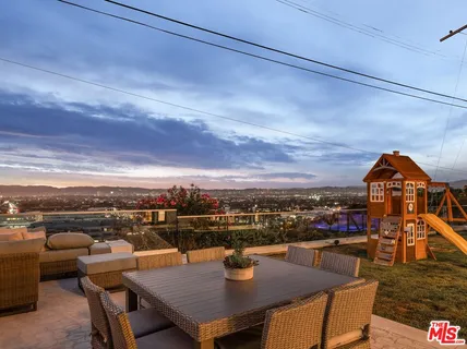 a view of a terrace with furniture