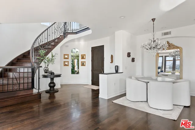 a view of a living room and chandelier