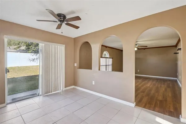 a view of livingroom with hardwood floor and a ceiling fan