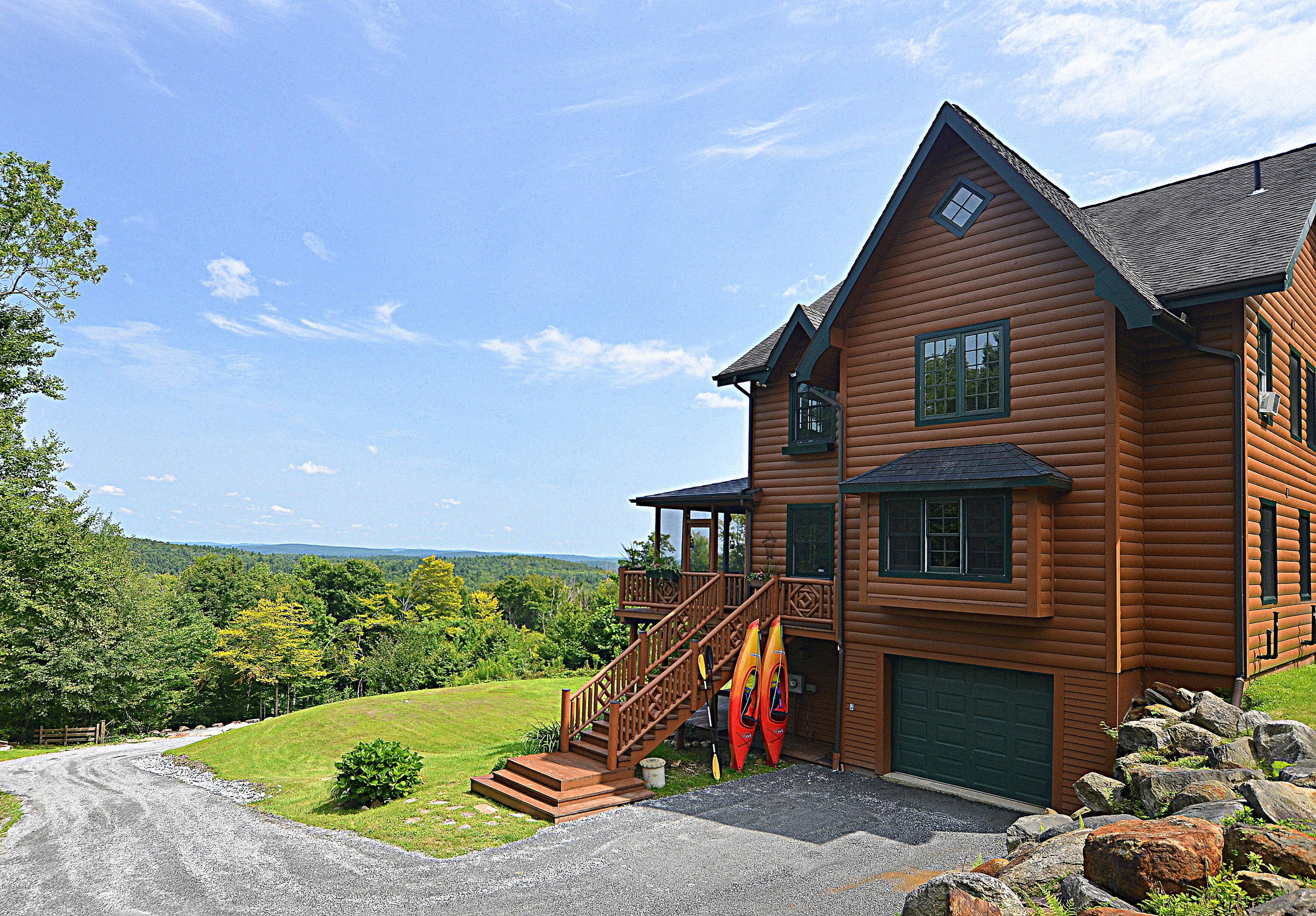 1297 Fred Snow Road Becket, MA 01223 - Photo 1 of 41 a view of a house with a backyard and a patio