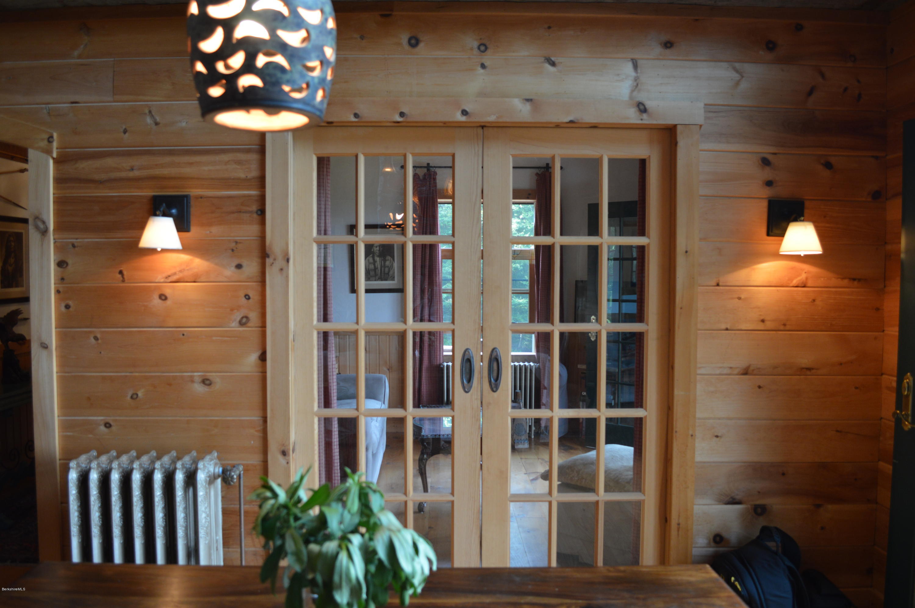 1297 Fred Snow Road Becket, MA 01223 - Photo 14 of 41 a view of a porch with a potted plant
