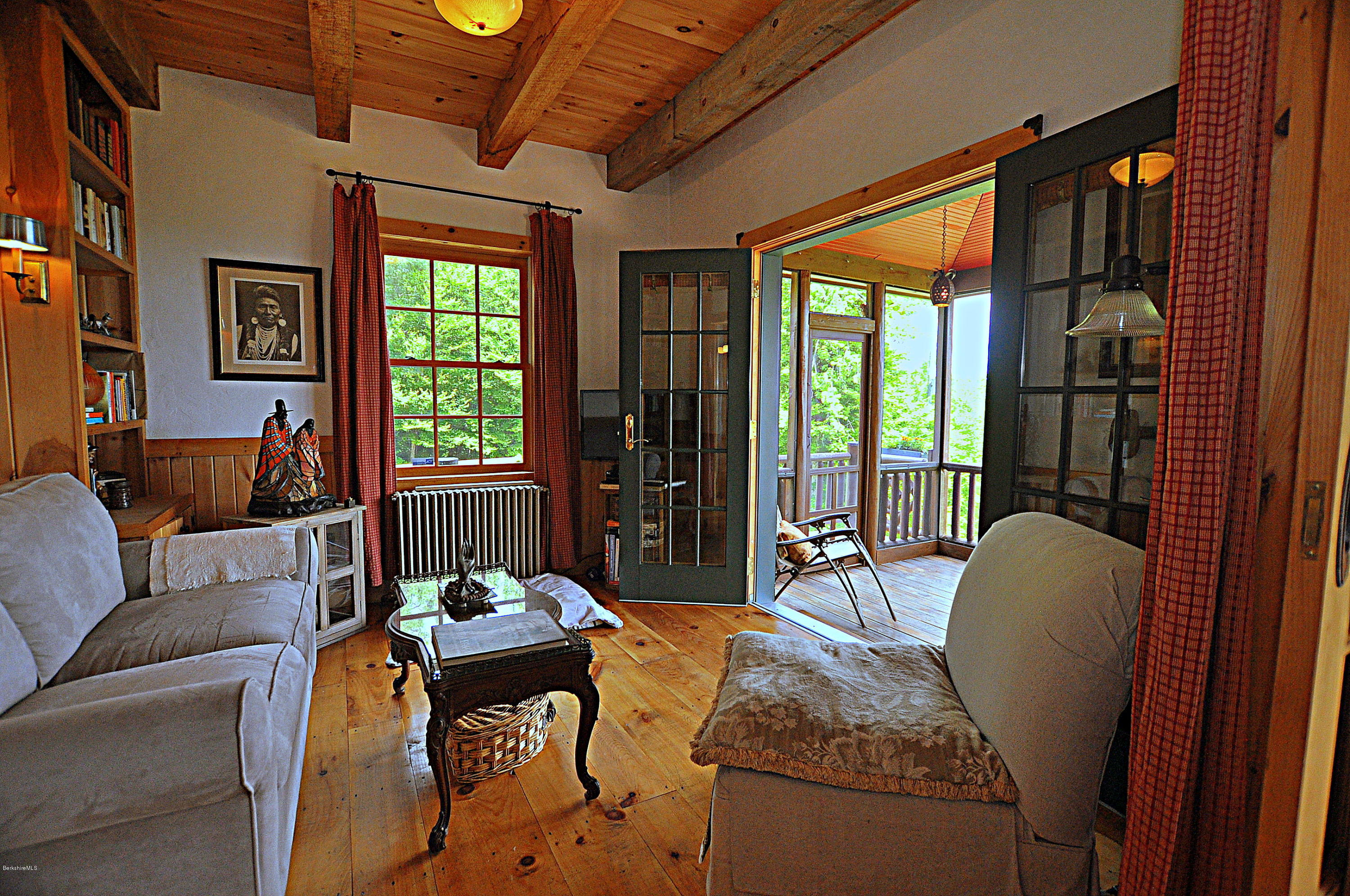 1297 Fred Snow Road Becket, MA 01223 - Photo 15 of 41 a living room with furniture and a large window
