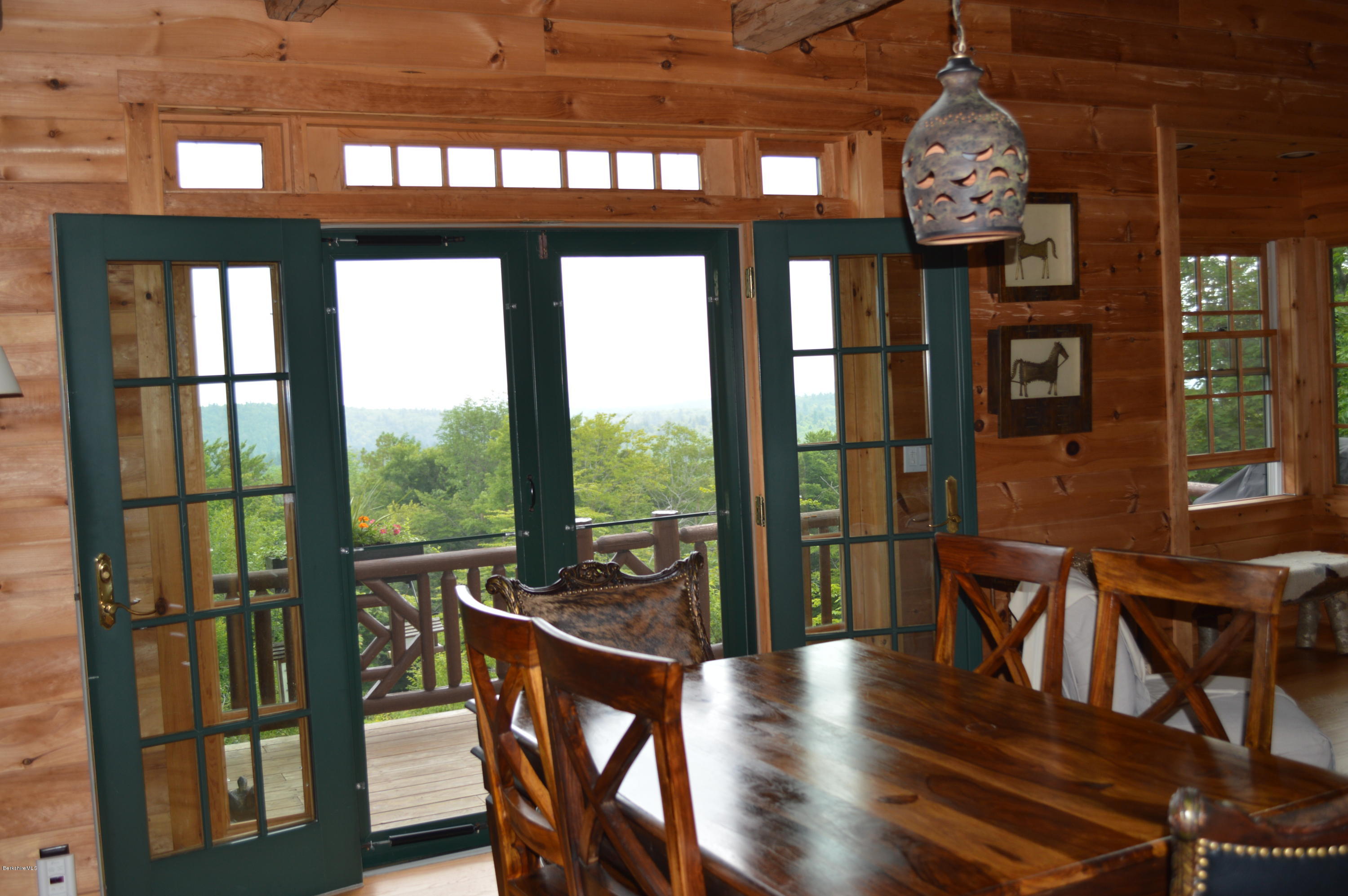 1297 Fred Snow Road Becket, MA 01223 - Photo 18 of 41 a view of a dining room with furniture window and wooden floor
