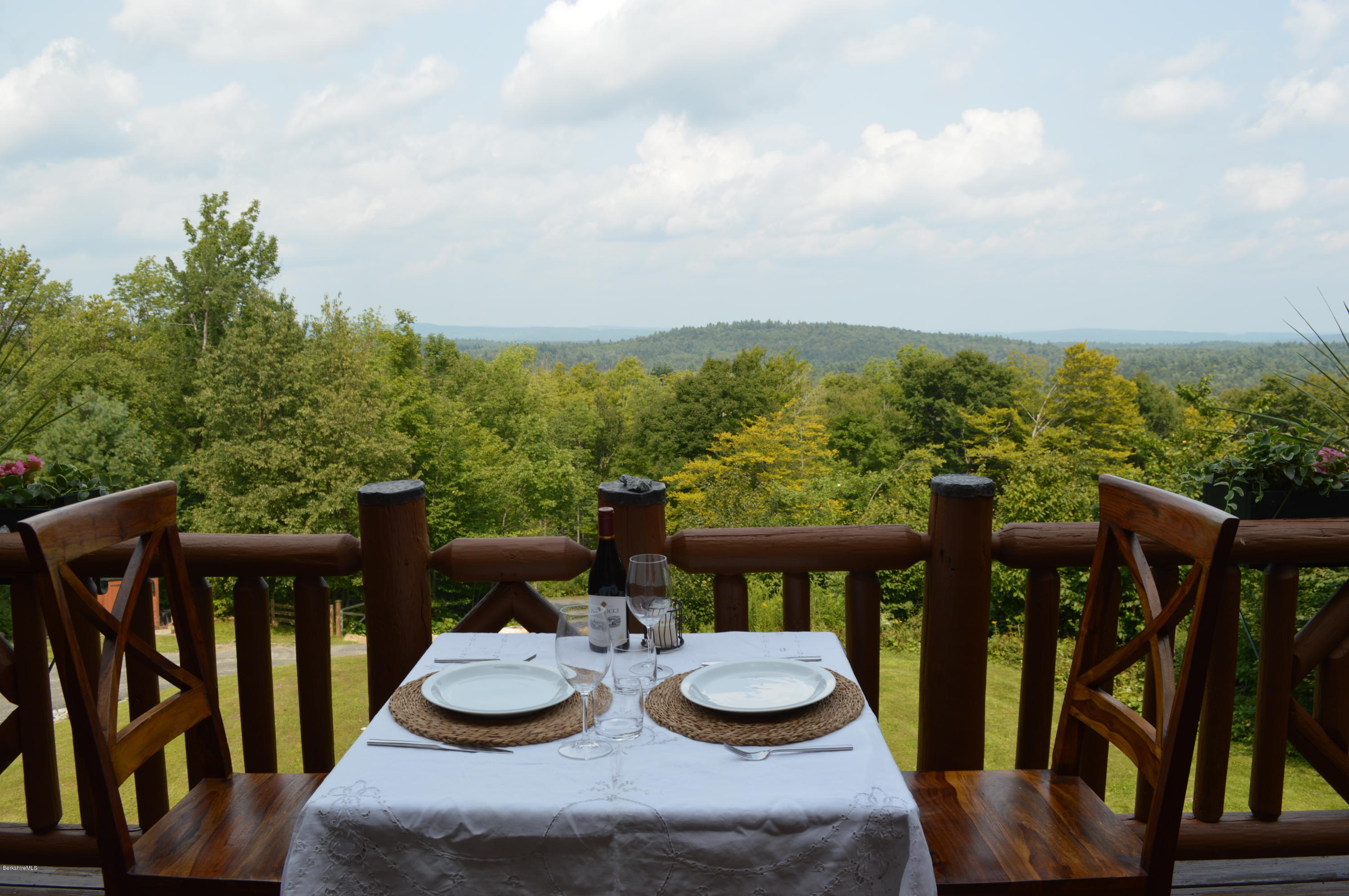 1297 Fred Snow Road Becket, MA 01223 - Photo 20 of 41 a view of a balcony with furniture and stove