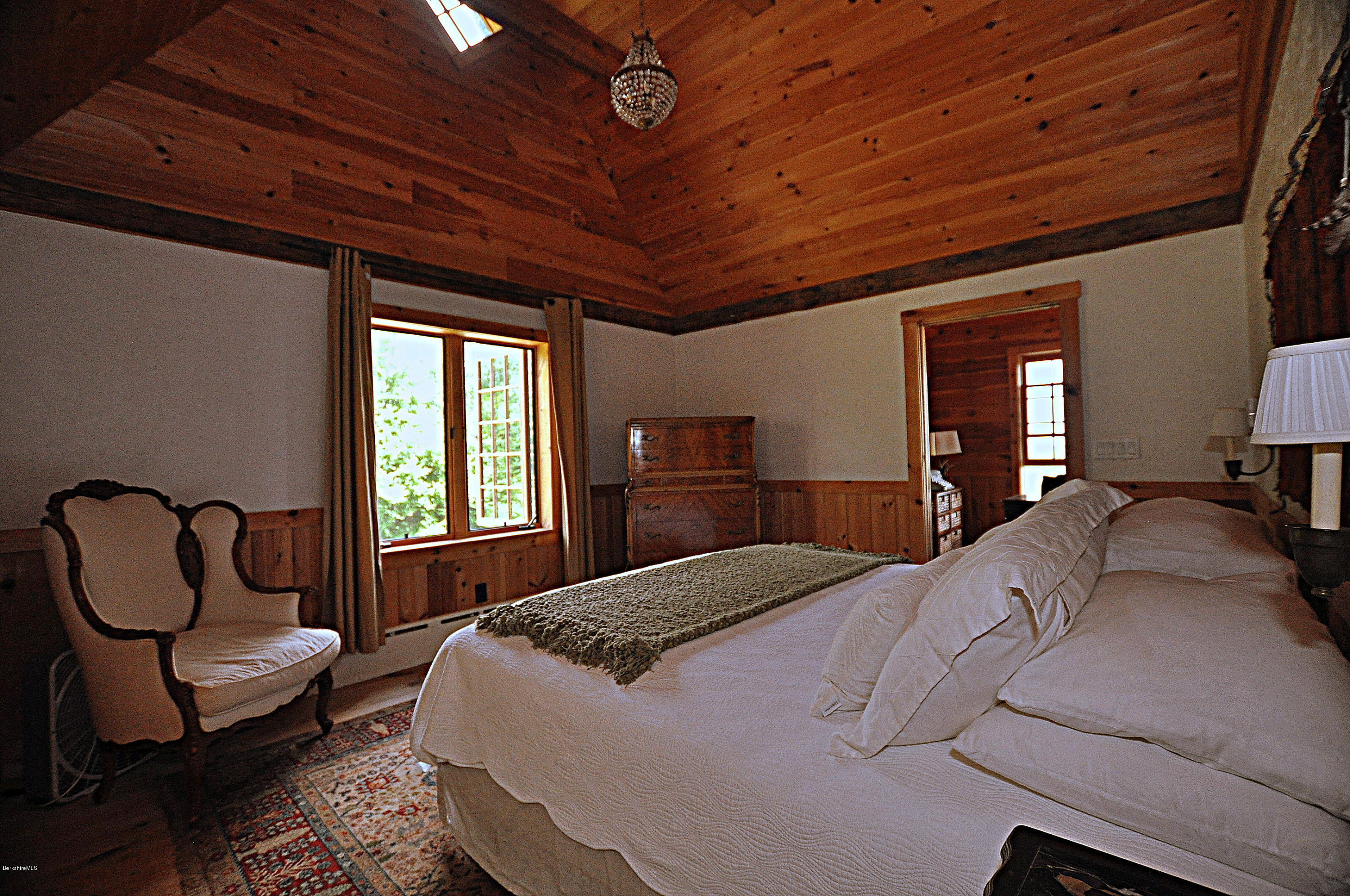 1297 Fred Snow Road Becket, MA 01223 - Photo 25 of 41 a bedroom with a bed chair and window