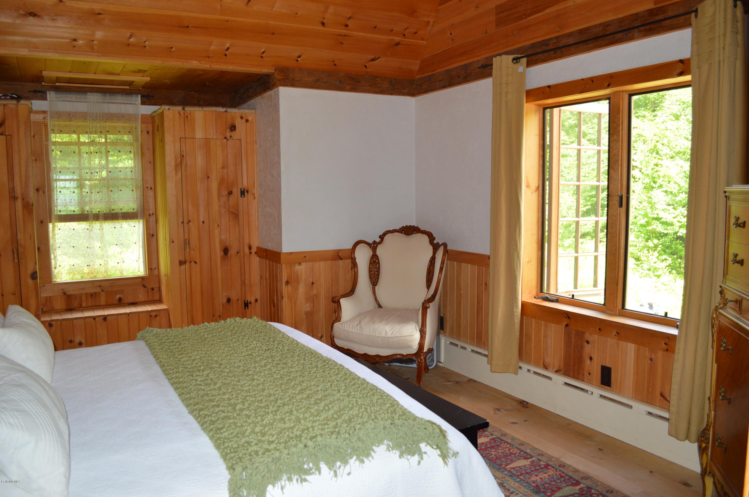 1297 Fred Snow Road Becket, MA 01223 - Photo 26 of 41 a view of a bedroom with furniture and windows