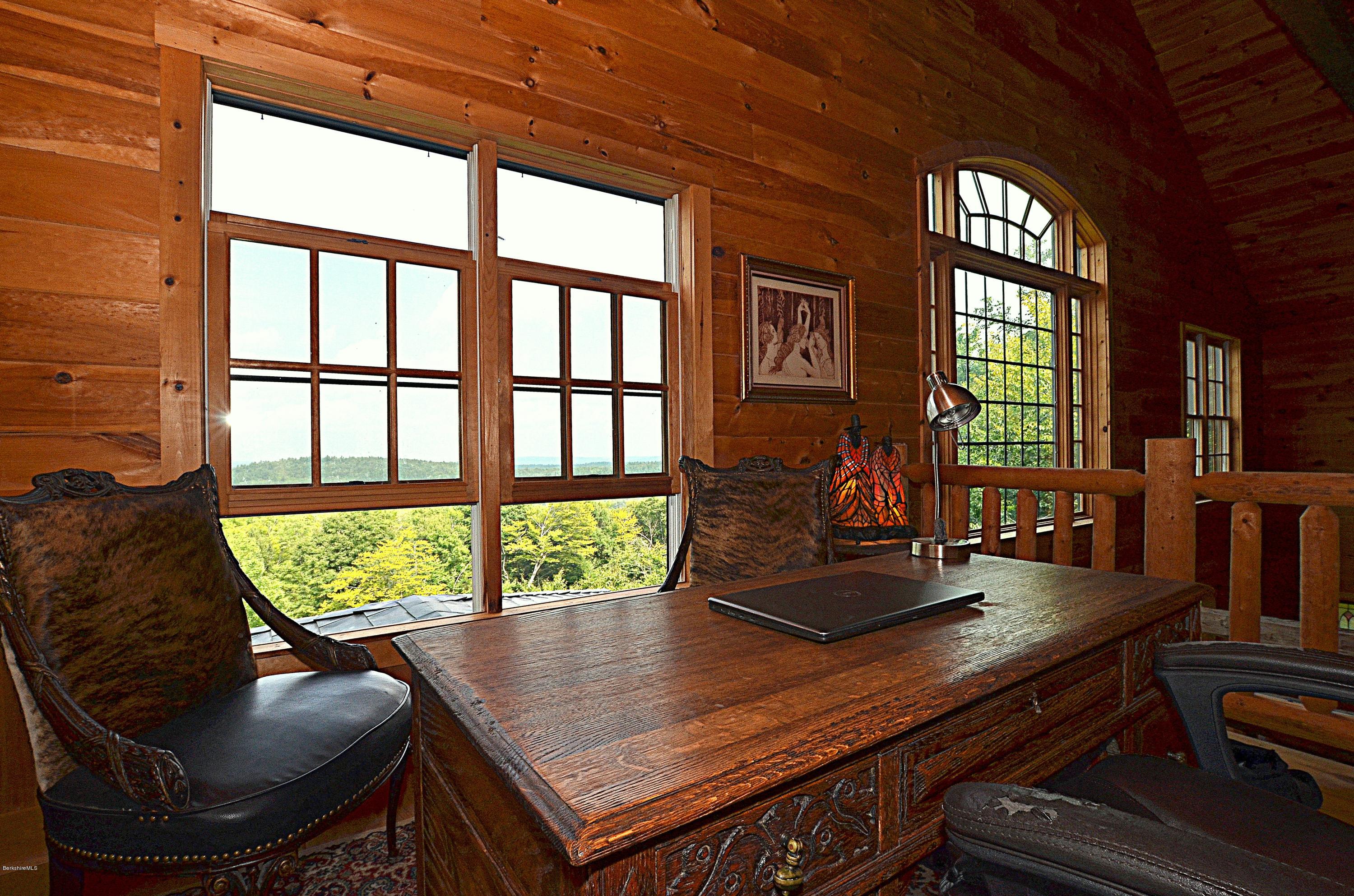 1297 Fred Snow Road Becket, MA 01223 - Photo 28 of 41 a view of a living room and floor to ceiling window or wooden floor