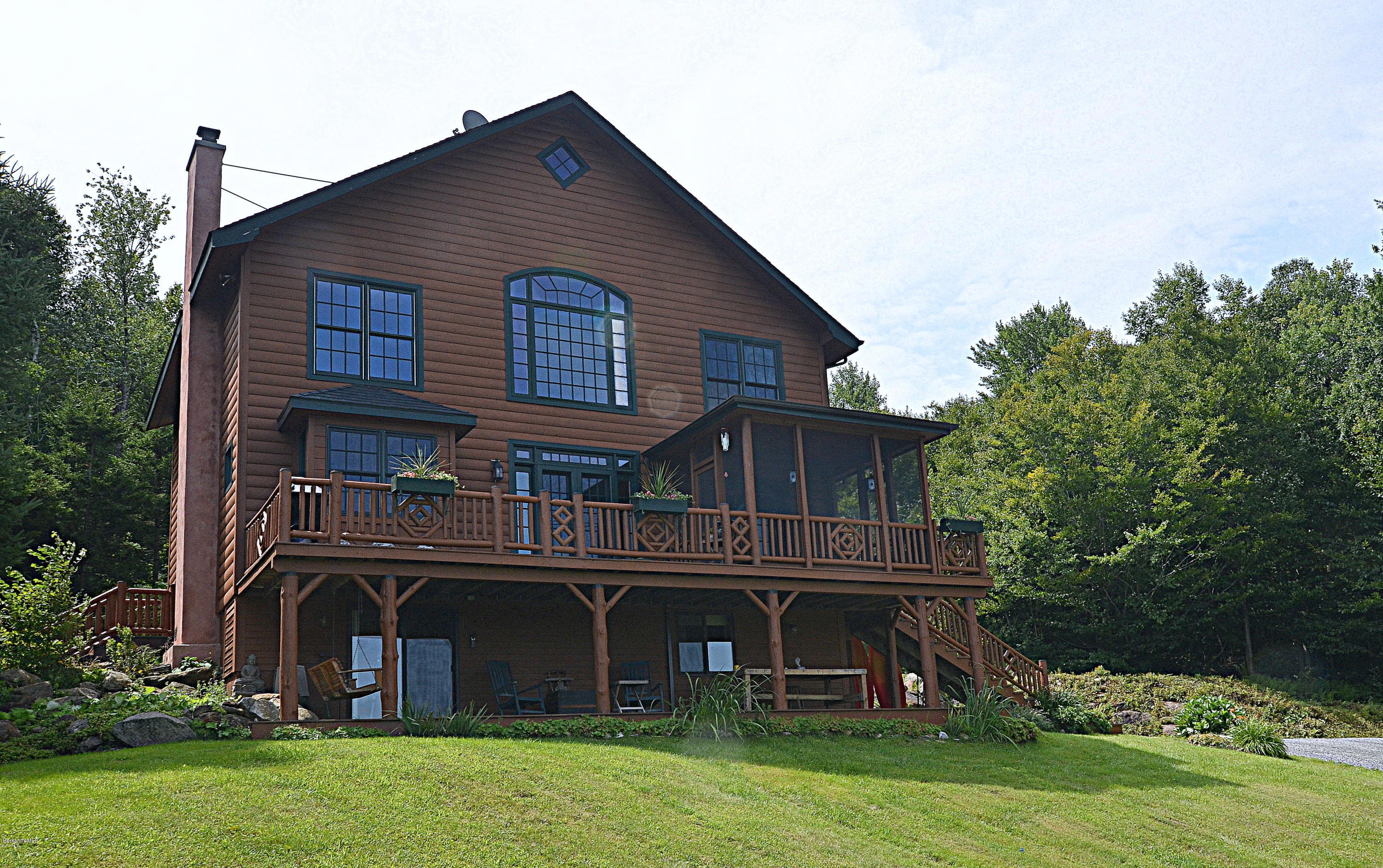 1297 Fred Snow Road Becket, MA 01223 - Photo 39 of 41 front view of a house with a yard