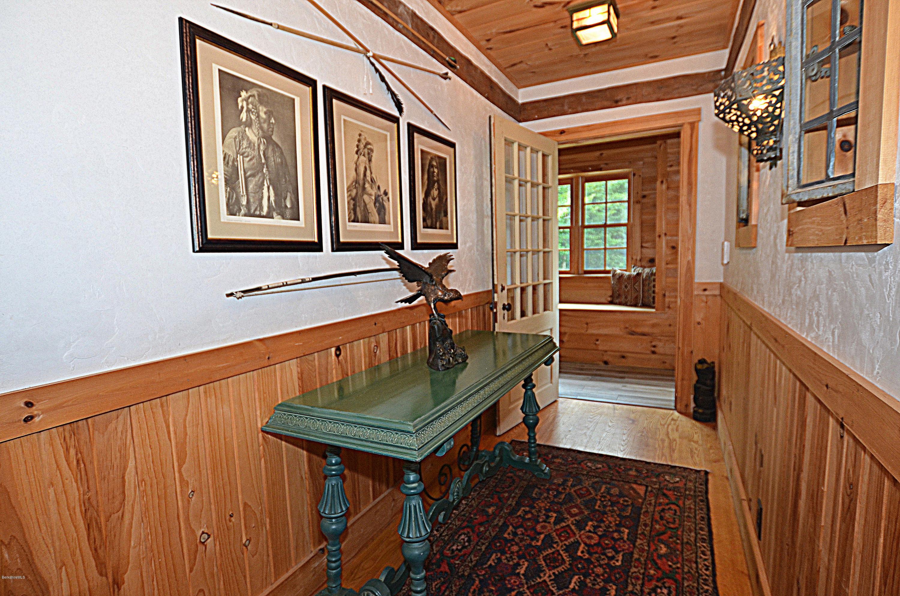 1297 Fred Snow Road Becket, MA 01223 - Photo 10 of 41 a living room with furniture a window and a rug