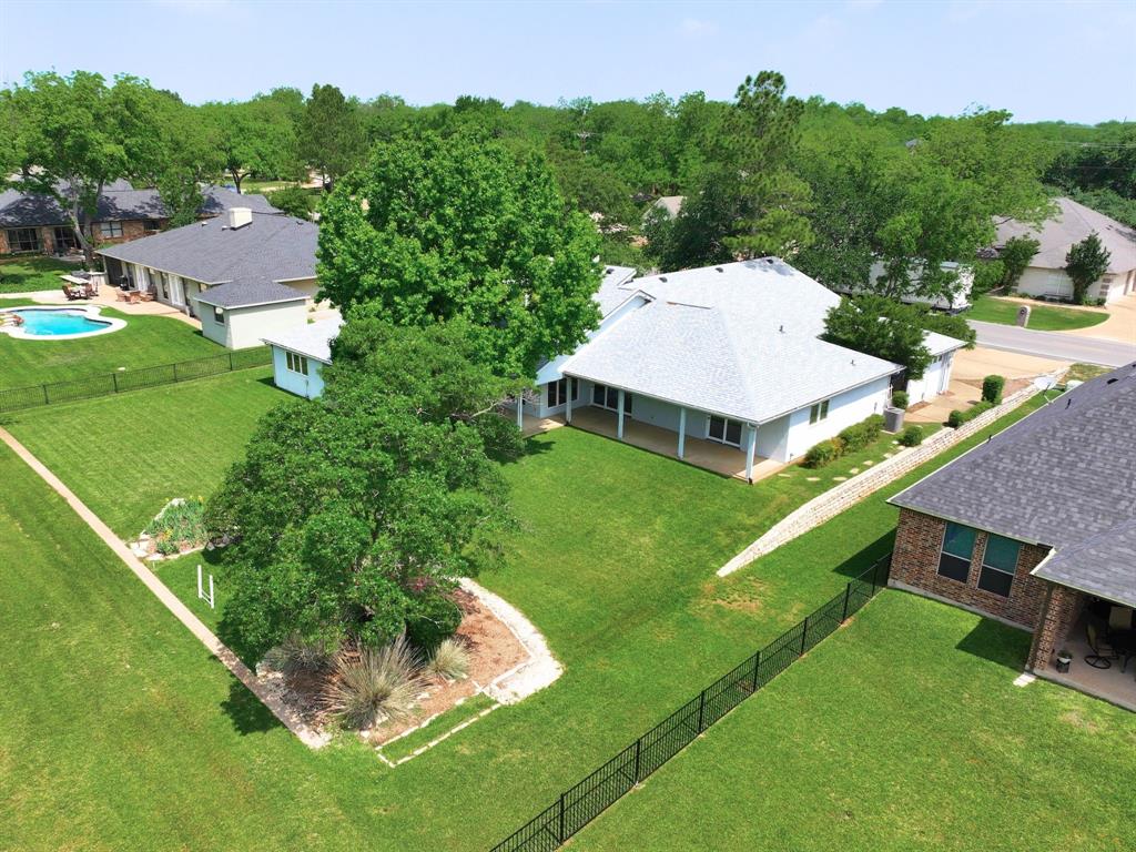 5131 Wedgefield Road Granbury, TX 76049 - Photo 2 of 33 5131 Wedgefield Road nestled on the lush greenery of Pecan Plantation's Golf Course
