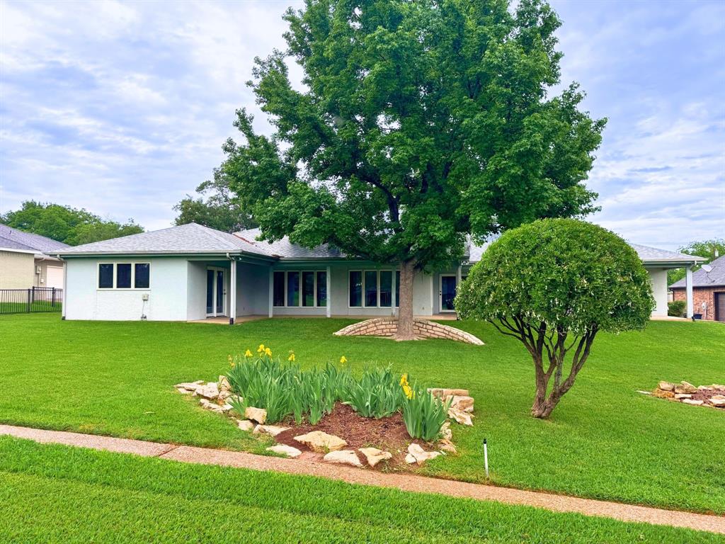 5131 Wedgefield Road Granbury, TX 76049 - Photo 4 of 33 5131 Wedgefield Road nestled on the lush greenery of Pecan Plantation's Golf Course