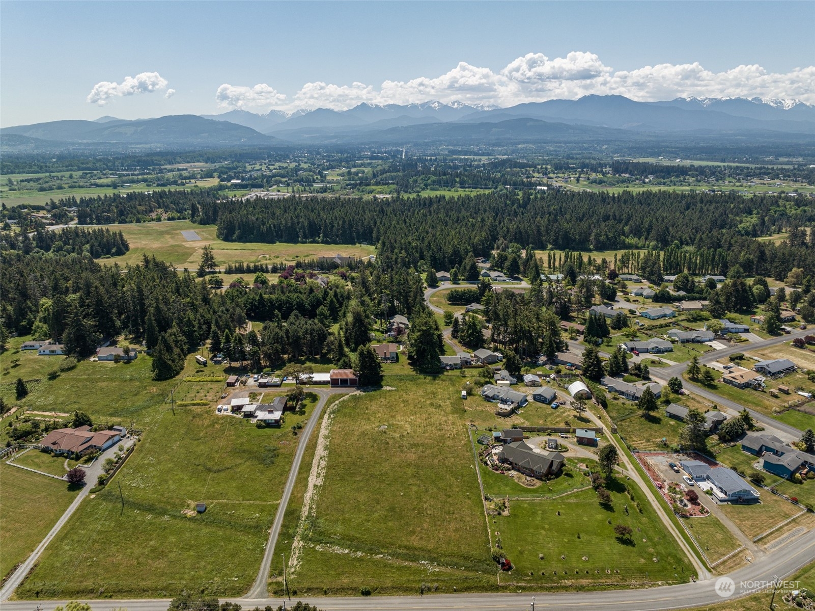 999 West Nelson Road, Unit B Sequim, WA 98382 - Photo 15 of 18 a view of a lake with a mountain