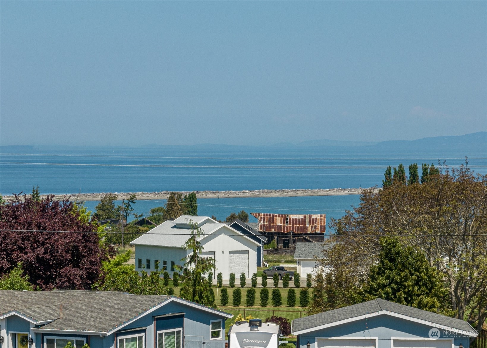 999 West Nelson Road, Unit B Sequim, WA 98382 - Photo 7 of 18 a view of a yard with an outdoor seating