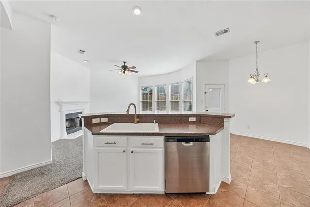a kitchen with a sink and cabinets