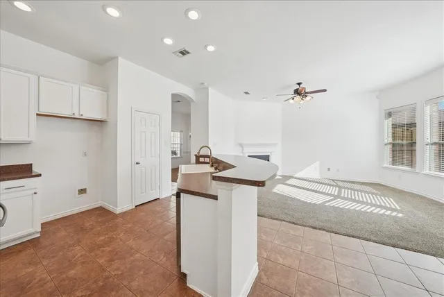a kitchen with stainless steel appliances granite countertop a sink and cabinets