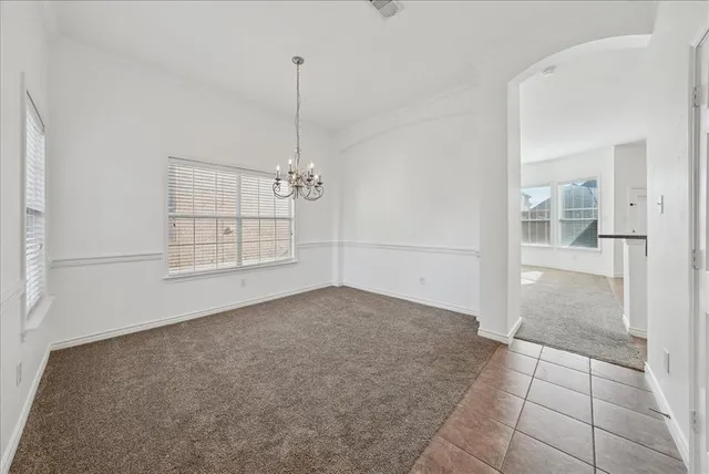 a view of empty room with windows