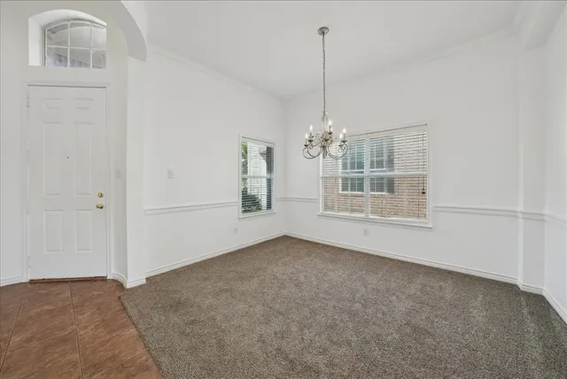 a view of empty room with windows