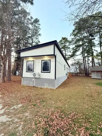 a house with trees in front of it