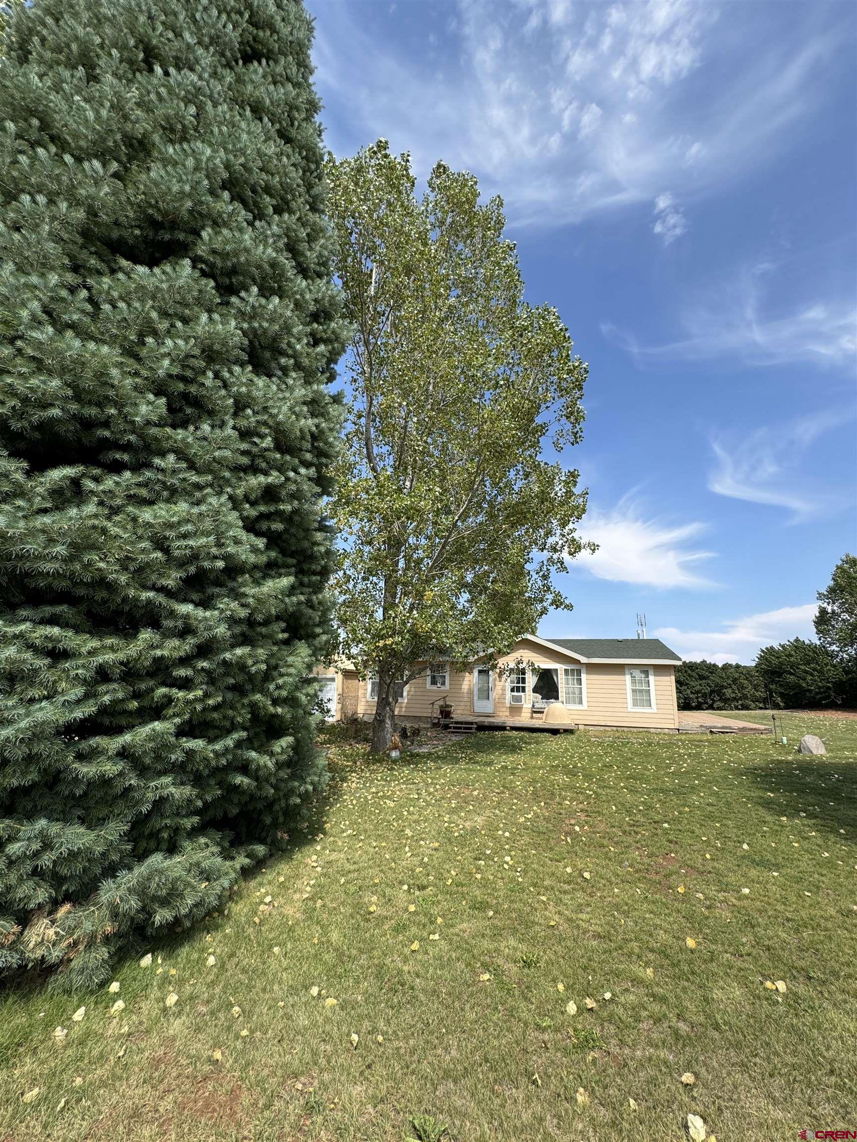 a view of a house with a yard