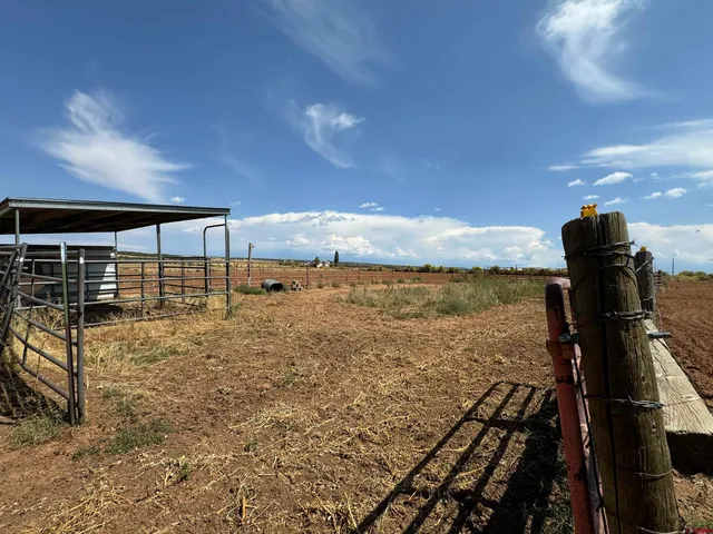a view of a livingroom with workspace and a window