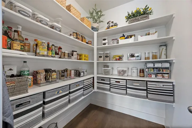 a view of workspace with a book shelf