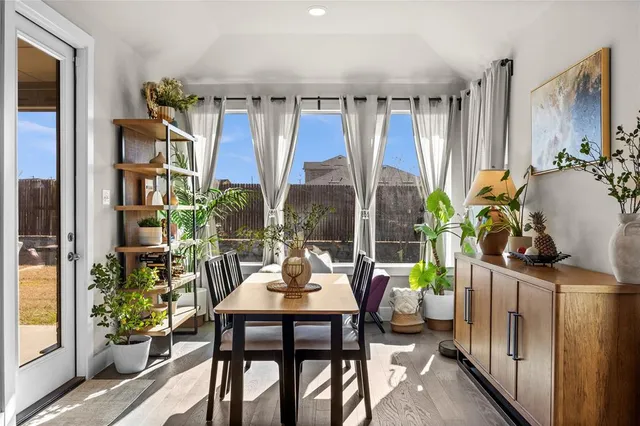a living room filled with furniture and a potted plant
