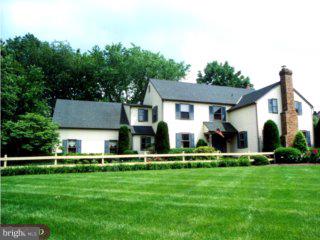552 Bartram Road Moorestown, NJ 08057 - Photo 1 of 6 a front view of house with a garden and trees