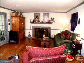 552 Bartram Road Moorestown, NJ 08057 - Photo 2 of 6 a living room with furniture and a fireplace