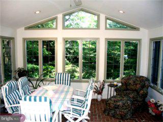 552 Bartram Road Moorestown, NJ 08057 - Photo 5 of 6 a view of a patio filled with furniture and garden