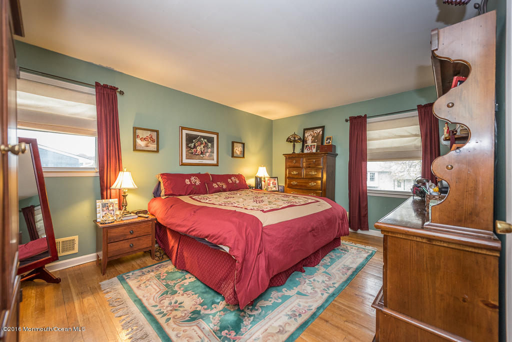 25 North Westfield Road Howell, NJ 07731 - Photo 14 of 25 a bedroom with a bed and wooden floor