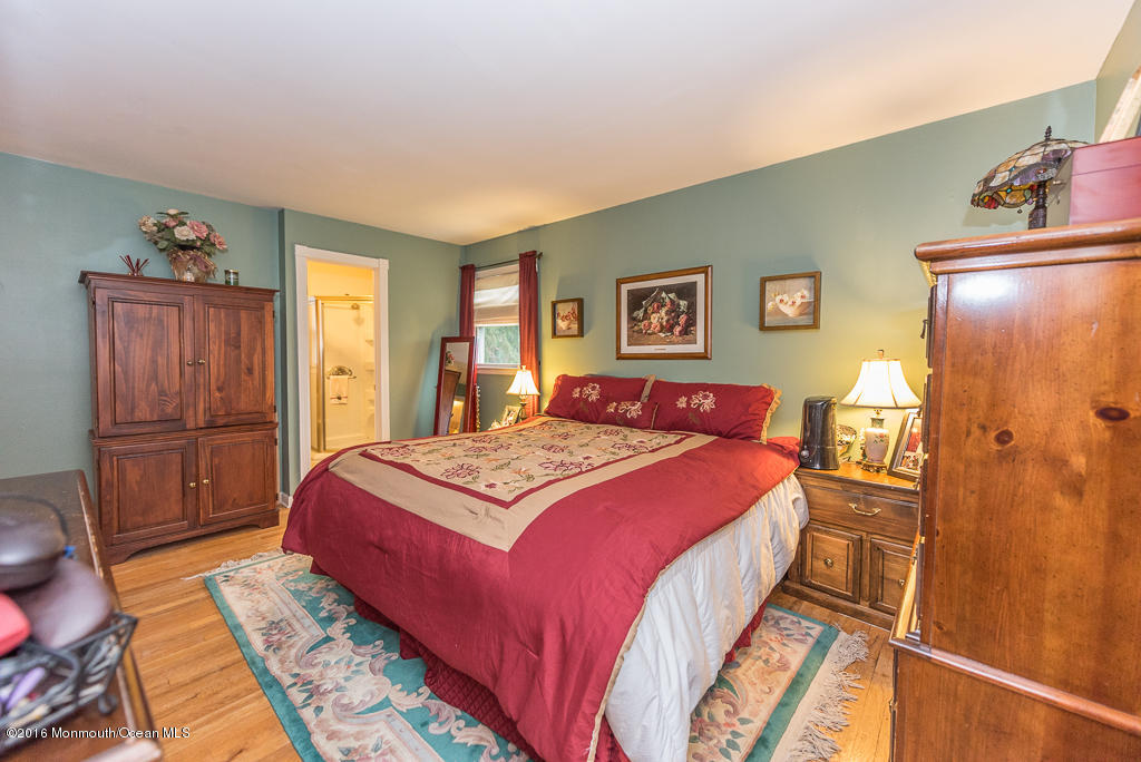 25 North Westfield Road Howell, NJ 07731 - Photo 15 of 25 a bedroom with a bed and wooden floor