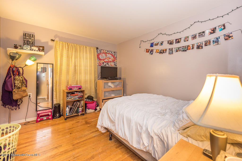 25 North Westfield Road Howell, NJ 07731 - Photo 17 of 25 a bedroom with a bed dresser and a window