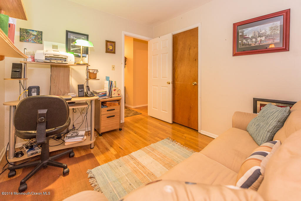 25 North Westfield Road Howell, NJ 07731 - Photo 19 of 25 a view of a workspace with furniture and a bedroom