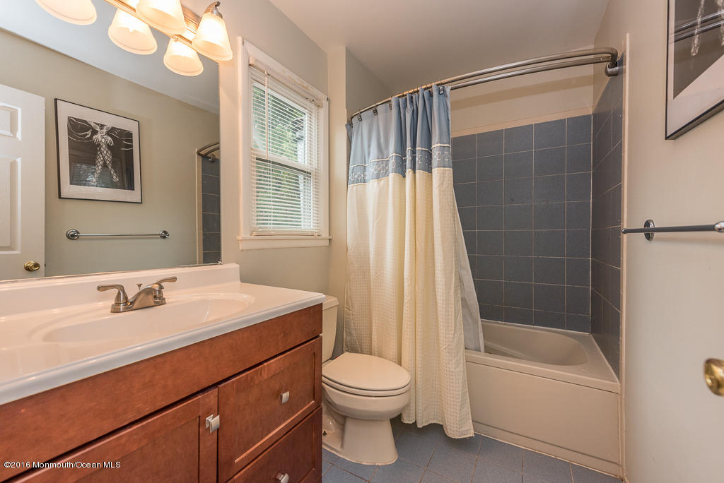 25 North Westfield Road Howell, NJ 07731 - Photo 20 of 25 a bathroom with a sink a toilet and shower