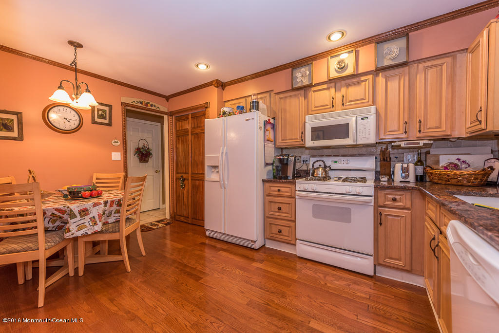 25 North Westfield Road Howell, NJ 07731 - Photo 5 of 25 a kitchen with stainless steel appliances granite countertop a refrigerator and microwave